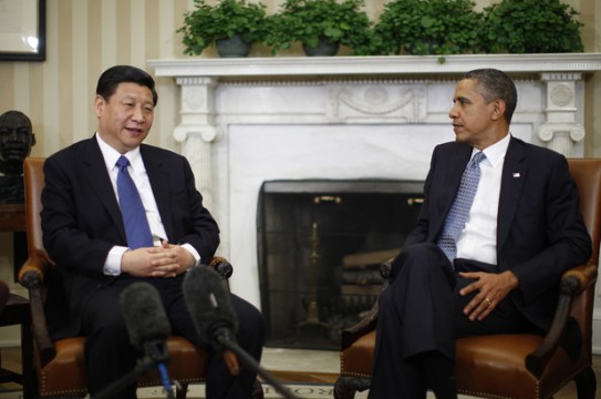 U.S. President Barack Obama (R) listens to China's Vice President Xi Jinping during their meeting in the Oval Office of the White House in Washington, February 14, 2012. Obama and Xi will hold talks on Tuesday that could help boost the international stature of China's leader-in-waiting while testing Obama's ability to balance U.S.-China diplomacy with election-year pressures. REUTERS/Jason Reed (UNITED STATES - Tags: POLITICS) - RTR2XUHB
