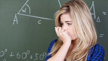 Teenager-doing-math-in-high-school-classroom-750x325