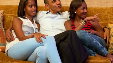 President Barack Obama and his daughters, Malia, left, and Sasha, watch on television as First Lady Michelle Obama takes the stage to deliver her speech at the Democratic National Convention, in the Treaty Room of the White House, Tuesday night, Sept. 4, 2012. 
(Official White House Photo by Pete Souza)